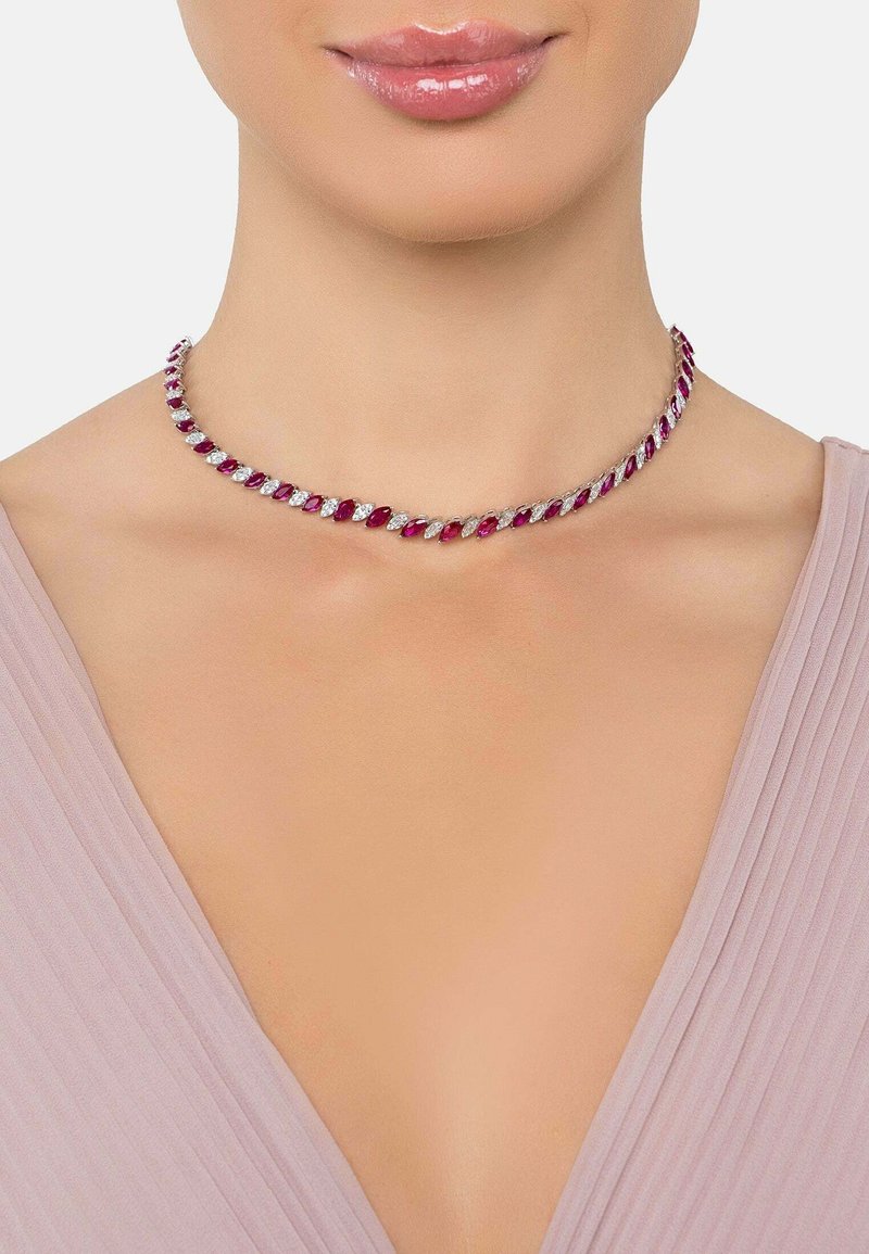 Choker necklace featuring alternating marquise-cut red gemstones and clear crystals set in silver-toned metal, with a twisted design.