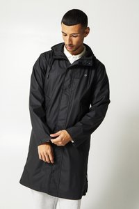 Black waterproof raincoat featuring a hood, snap buttons, and side pockets, made from smooth plastic material. Length extends to mid-thigh.