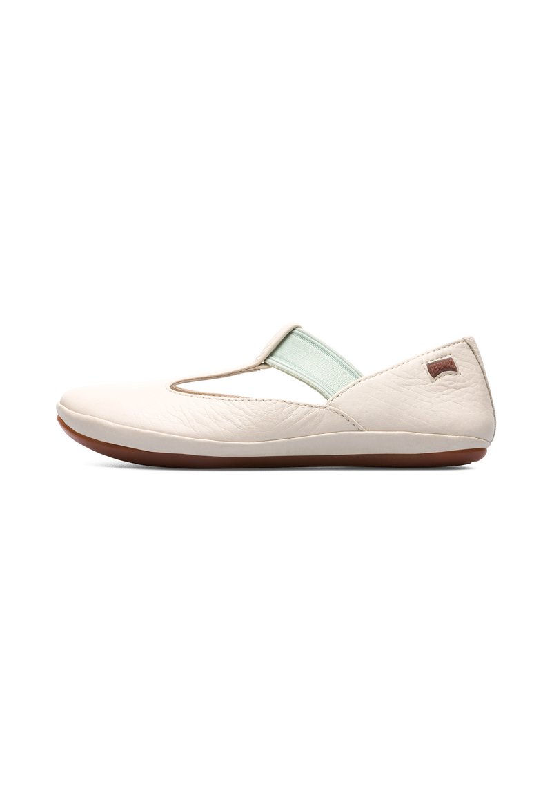 Leather slip-on shoe in cream with a mint green elastic strap. Rounded toe and flat rubber sole with a textured finish.