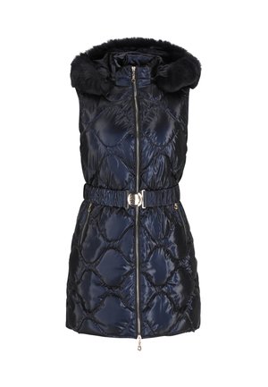 Navy puffer vest with a detachable faux fur hood, diamond quilted texture, front zipper, belted waist, and side pockets.
