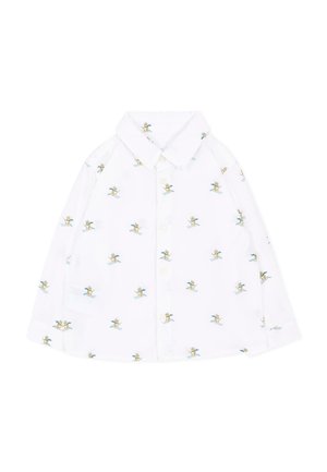 Camicia bianca a maniche lunghe con bottoni, con piccole illustrazioni di sciatori in blu e giallo su tutta la superficie.