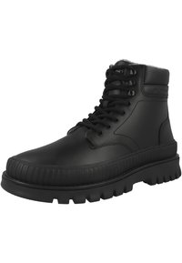 Black high-top leather boot with thick ridged sole, padded ankle collar, and black laces threaded through metal eyelets.