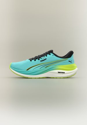 A turquoise running shoe with black laces, black and yellow accents, a white sole, and "NITRO" branding near the heel on a plain background.