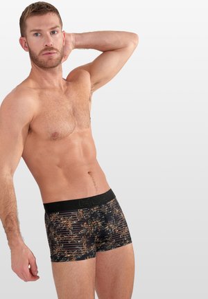 Schwarze Boxershorts mit floralem und gestreiftem Muster, ausgestattet mit einem schwarzen Bund und einem weichen, dehnbaren Stoff.