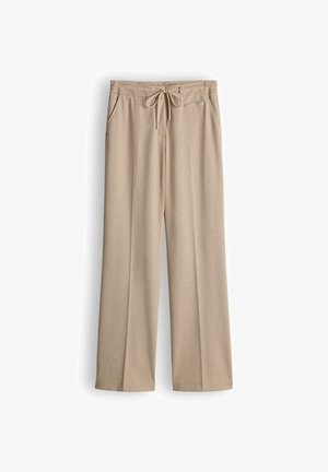 Beige, weit geschnittene Hosen aus weichem Material mit einem Kordelzug in der Taille und Fronttaschen, die ein sauberes, schlankes Design aufweisen.