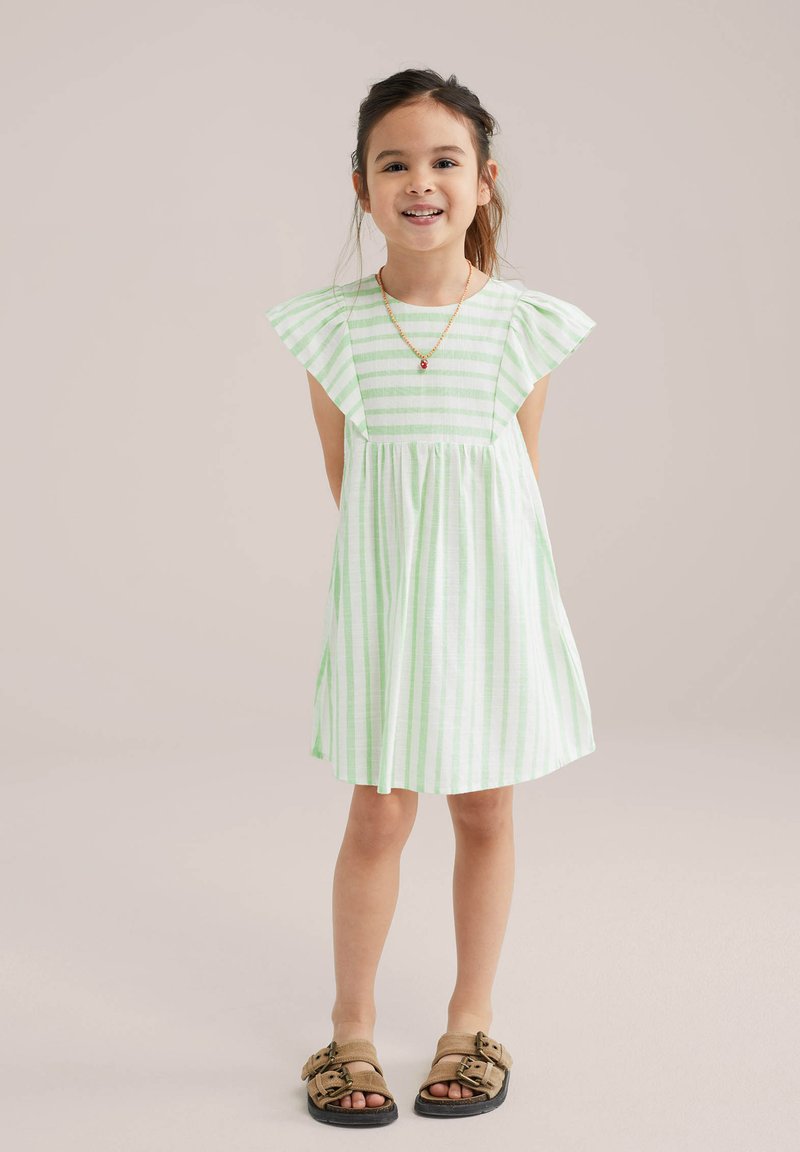 Light green striped dress with short flutter sleeves, gathered waist, and knee-length hem. Worn with brown sandals. Simple design.