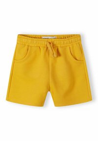 Shorts jaunes vifs à taille élastique avec cordon de serrage et deux poches avant, conçus pour un usage quotidien.