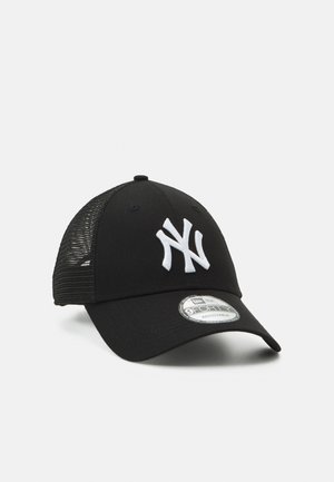 Black baseball cap with a white embroidered "NY" logo, mesh back, adjustable strap, and curved bill. Features a smooth fabric texture.