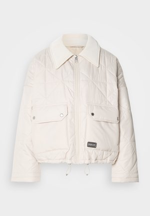 Padded white cropped jacket with a diamond quilted pattern, featuring a large collar, front zipper, and two flap pockets. Brand label visible.
