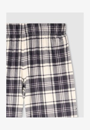Pantaloni a quadri in crema, nero e viola. Presentano un elastico in vita e una consistenza morbida. Motivo a scacchi prominente su tutta la superficie.