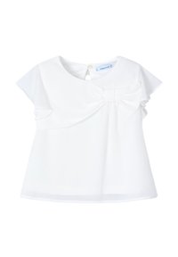 Top bianco a maniche corte con scollatura rotonda e apertura a goccia sul retro. Presenta un grande dettaglio a fiocco sul davanti e un tessuto morbido e liscio.