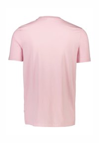 Ljusrosa t-shirt med kort ärm, tillverkad av mjuk bomull. Har en rund halsringning och en rak nederkant med en enkel, slät textur.