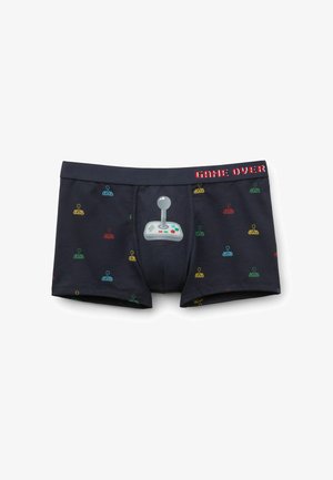 Boxers en coton noir ornés de graphiques colorés de joystick, d'un imprimé de manette de jeu proéminent et du texte "GAME OVER" sur la ceinture.