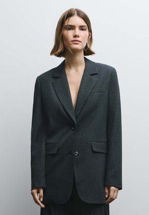 Dark gray pinstriped blazer with a classic lapel, single button closure, and two front pockets, featuring a structured fit and smooth texture.