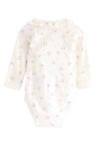 Långärmad baby bodysuit i krämfärg med blommönster. Har en volangkrage och mjukt bomullsmaterial. Tryckknäppe i botten.