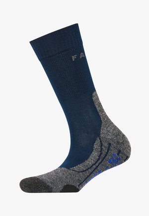 Marineblauer Socke mit einem strukturierten grauen Fersen- und Zehenbereich, der blaue Akzente aufweist und einen verstärkten Bogen für mehr Komfort bietet. Rippbund für einen sicheren Sitz.