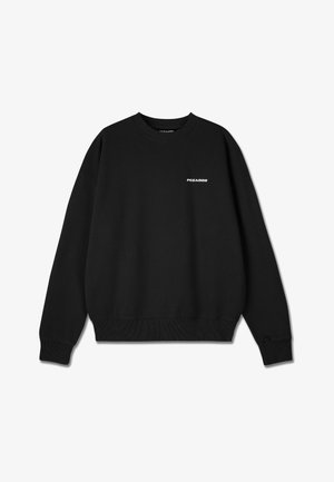 Must must, miselti kangas, millel on ümar kaelus, soonikkoes käised ja alumine äär, ning valge "PEGADOR" logo rinna peal.