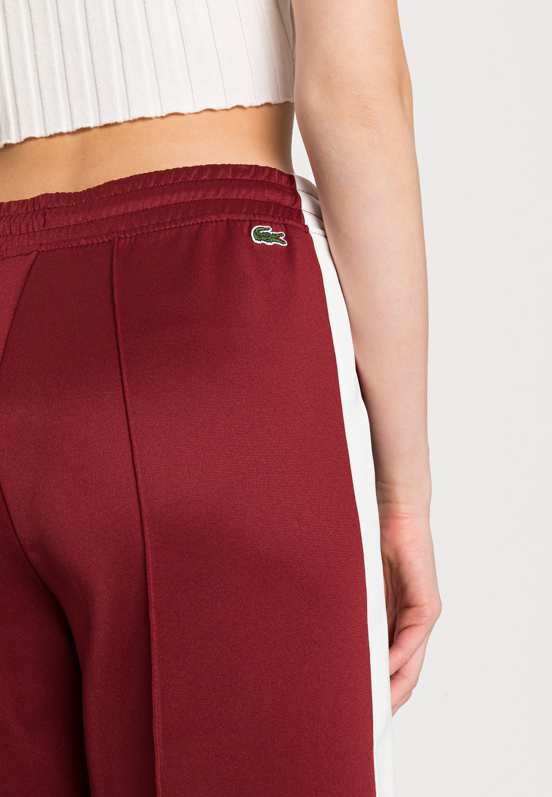 Lacoste Tracksuit bottoms - flour/pinot 
