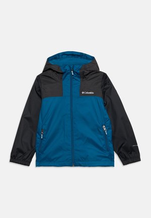 Veste Columbia bleue et noire zippée avec capuche, deux poches avant zippées et poignets élastiques aux manches longues.