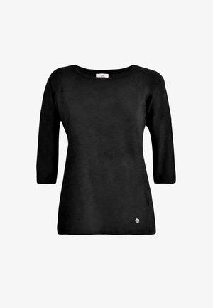 Černý top s dlouhým rukávem, kulatým výstřihem a raglánovými rukávy. Hladká textura, mírně volný střih, s malým logem na spodní straně.