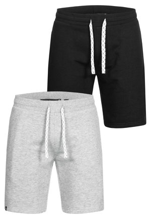 Deux paires de shorts décontractés en noir et gris clair, chacun avec des cordons blancs et des ceintures élastiques.