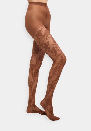 Brune strømpebukser med mønster har et blomsterlignende blonderdesign, semi-transparent øvre lårdel og en solid nedre seksjon med en jevn finish.