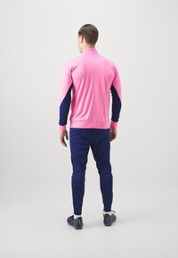 Nike Performance ATLETICO MADRID NIKE DF STRIKE TRACKSUIT THIRD - Equipación de clubes - pink glow/blue void