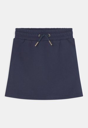 Jupe en coton bleu marine avec une taille à cordon, ornée d'accents en métal doré. Design simple en ligne A avec une texture lisse.