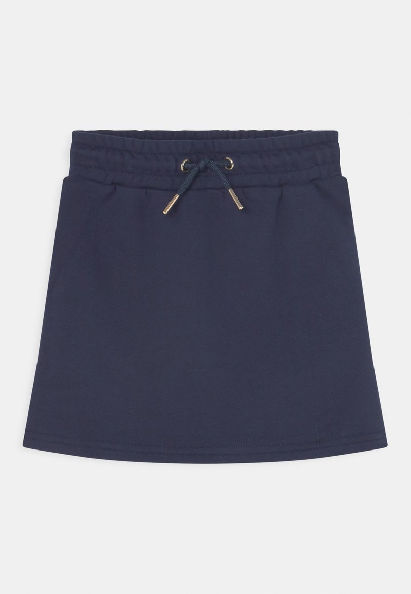 Jupe en coton bleu marine avec une taille à cordon, ornée d'accents en métal doré. Design simple en ligne A avec une texture lisse.