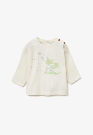 Krémově zbarvené kojenecké tričko s dlouhým rukávem a knoflíky na rameni, s ilustrací zeleného draka a zajíčka a nápisem "otevři své srdce a LETEJ."