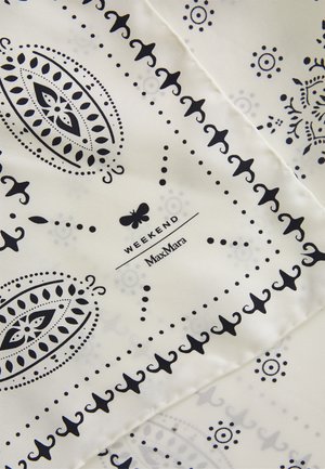 White fabric with black paisley and dot patterns, featuring a small butterfly icon and the text "WEEKEND MaxMara."