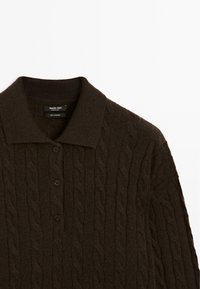 Dark brown cable-knit cashmere sweater with collar and three buttons on the front, made by Massimo Dutti.