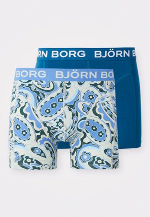 Pakke med to boxershorts som har et blått paisley-mønster og et solid blått par. Begge har en myk elastisk midje med "BJÖRN BORG"-logo.