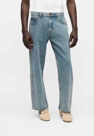 adidas Originals, FIREBIRD UNISEX - Jeans a sigaretta - worn blue denim