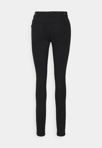 Vero Moda Tall VMTANYA PIPING - Calças de ganga de corte skinny - black
