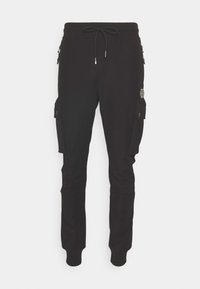 Pantalon cargo jogger noir avec ceinture à cordon, poches zippées sur les hanches, poches à rabat à boutons sur les cuisses et chevilles ajustées.