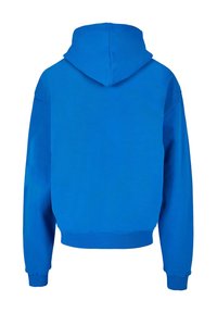 Felpa con cappuccio blu royal, realizzata in un tessuto morbido, con polsini a costine e un taglio cropped con orlo arrotondato. Design semplice e senza decorazioni.