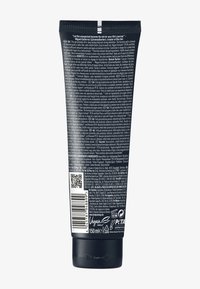 Tubetto nero in finitura opaca, con testo bianco e un codice QR. Contiene 150 ml di prodotto, etichettato come vegano e approvato da PETA.