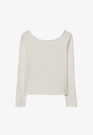Langærmet top i lysebeige, lavet af blødt stof. Har en bred halsudskæring og en afslappet pasform, med diskrete stikninger langs sømmene.