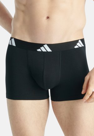 Schwarze Boxershorts mit körpernahem Design, elastischem Bund mit weißen Adidas-Logo-Akzenten und einem glatten, dehnbaren Stoff. 