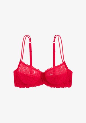 Soutien-gorge rouge à armatures en dentelle avec motif floral et double bretelles réglables sur fond blanc.