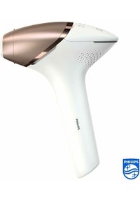 Dispositivo per la rimozione dei peli Philips, di colore bianco con accenti in oro rosa. Design elegante ed ergonomico con impugnatura testurizzata e pulsanti di controllo sulla parte superiore.