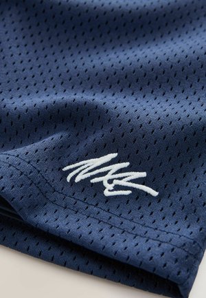 Navy athletic shorts made of breathable mesh fabric, featuring a white embroidered logo and small perforations for ventilation.