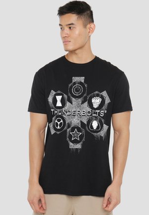 Black cotton t-shirt featuring a central graphic with hexagonal designs and the word "THUNDERBOLTS" in white, offering a bold contrast.