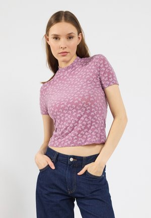 Light purple fitted top featuring a butterfly pattern, short sleeves, and a high neckline, made of a sheer, stretchy material.