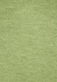 Hellgrüner gestrickter Stoff mit einer sanften Textur, der ein einheitliches Muster und subtile Farbvariationen aufweist.