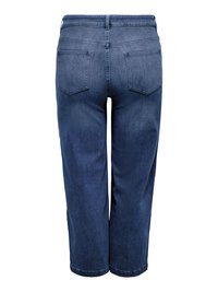 Jean en denim bleu foncé longueur genou avec poches arrière et coutures visibles, montré de dos sur fond blanc.