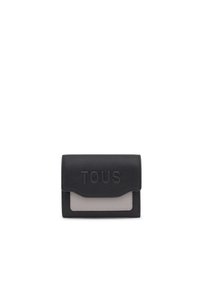 Black leather wallet with a grey accent panel, featuring embossed "TOUS" logo on the front. Compact rectangular shape, textured surface.