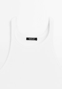 Witte geribde tanktop met brede schouderbanden, voorzien van een zwart etiket met de tekst "Massimo Dutti, Made in Portugal." Zacht, rekbaar materiaal.