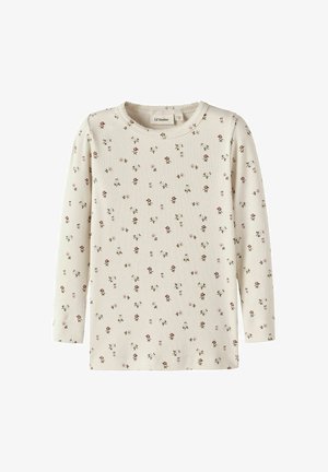 Crèmekleurige, geribde longsleeve met een klein roze en groen bloemenpatroon, ronde hals, getoond tegen een egale achtergrond.